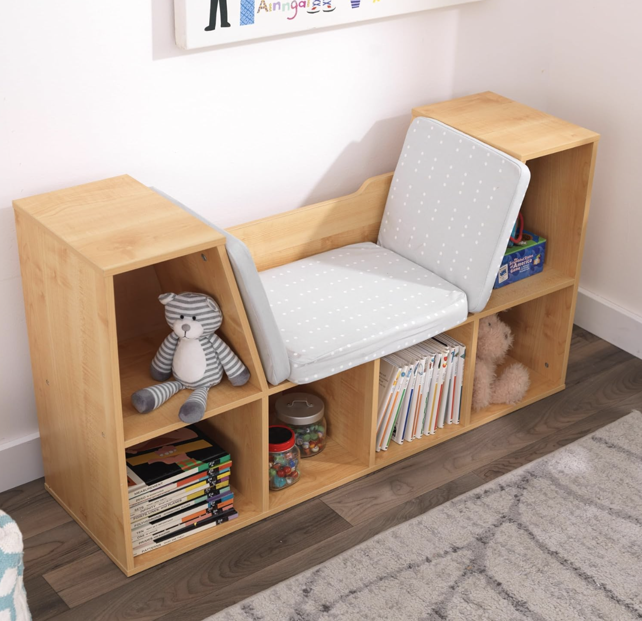 Bookcase with built-in reading nook and extra storage, perfect for organizing toys and books in small spaces.